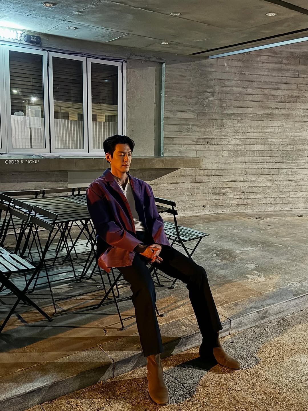 Photo by 김우빈 on October 13, 2025. May be an image of wingtip shoes, overcoat, duffle coat, cigarette and text.