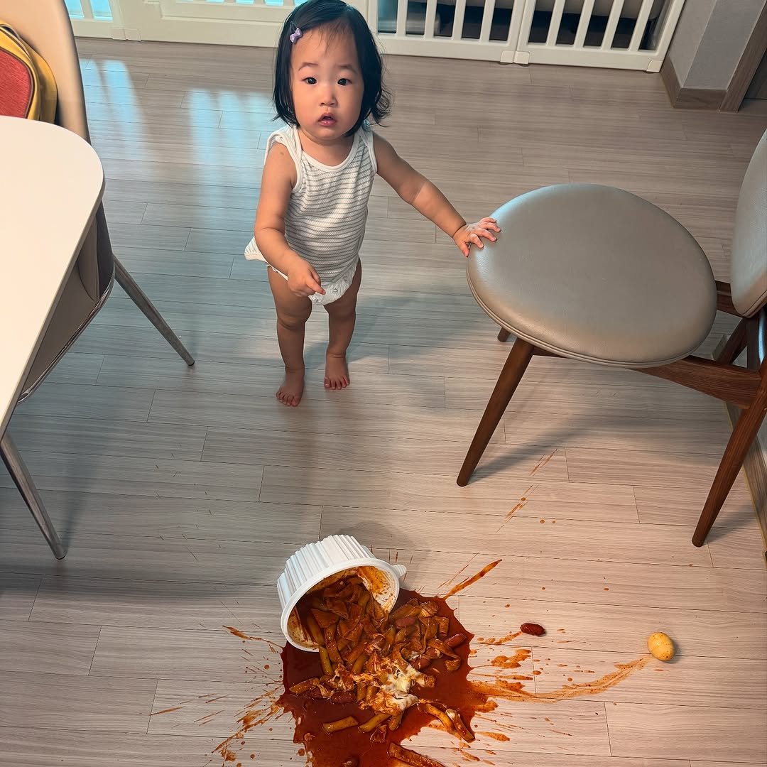 Photo by 최서안 on August 12, 2025. May be an image of 1 person, baby, diaper, carpet, placemat, sauce and text.
