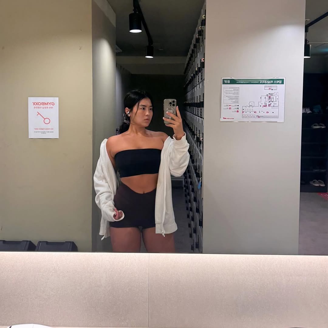 Photo by 우니 woony on September 19, 2025. May be a selfie of activewear, shorts, top, sweatpants, mirror and text.