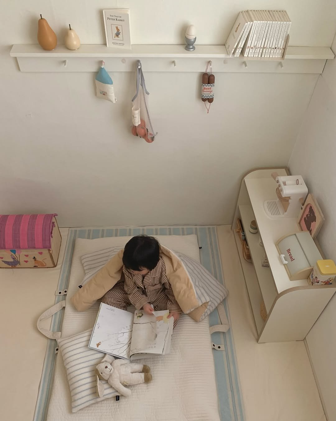 Photo shared by MIJI on December 15, 2025 tagging @comma_c_official. May be an image of child, dollhouse, bunk bed, bed, baby bed, mattress, blanket, bedroom and text.