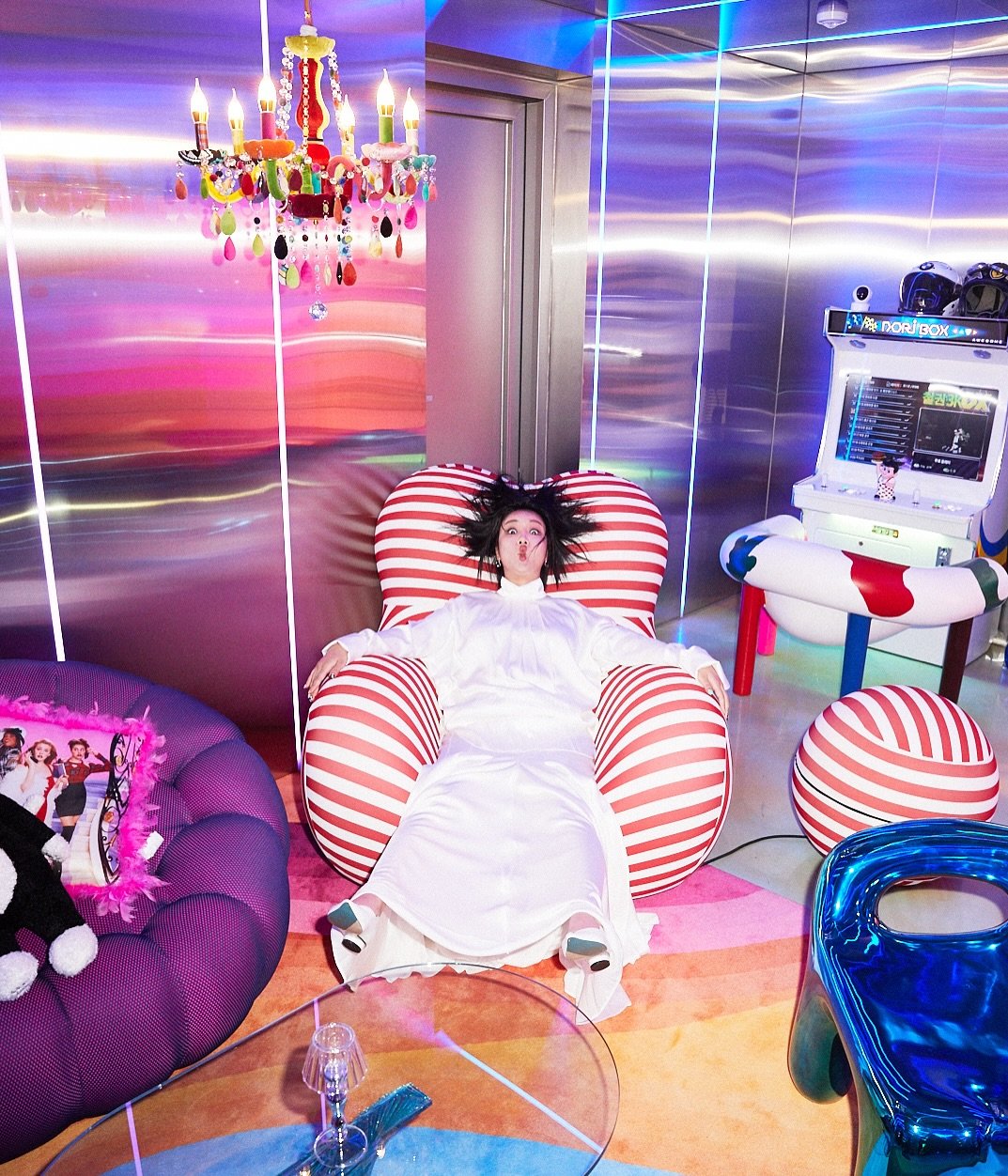 Photo shared by 랄랄 on September 25, 2025 tagging @esquire.korea. May be an image of 1 person, telephone, chaise lounge, tinsel and text.