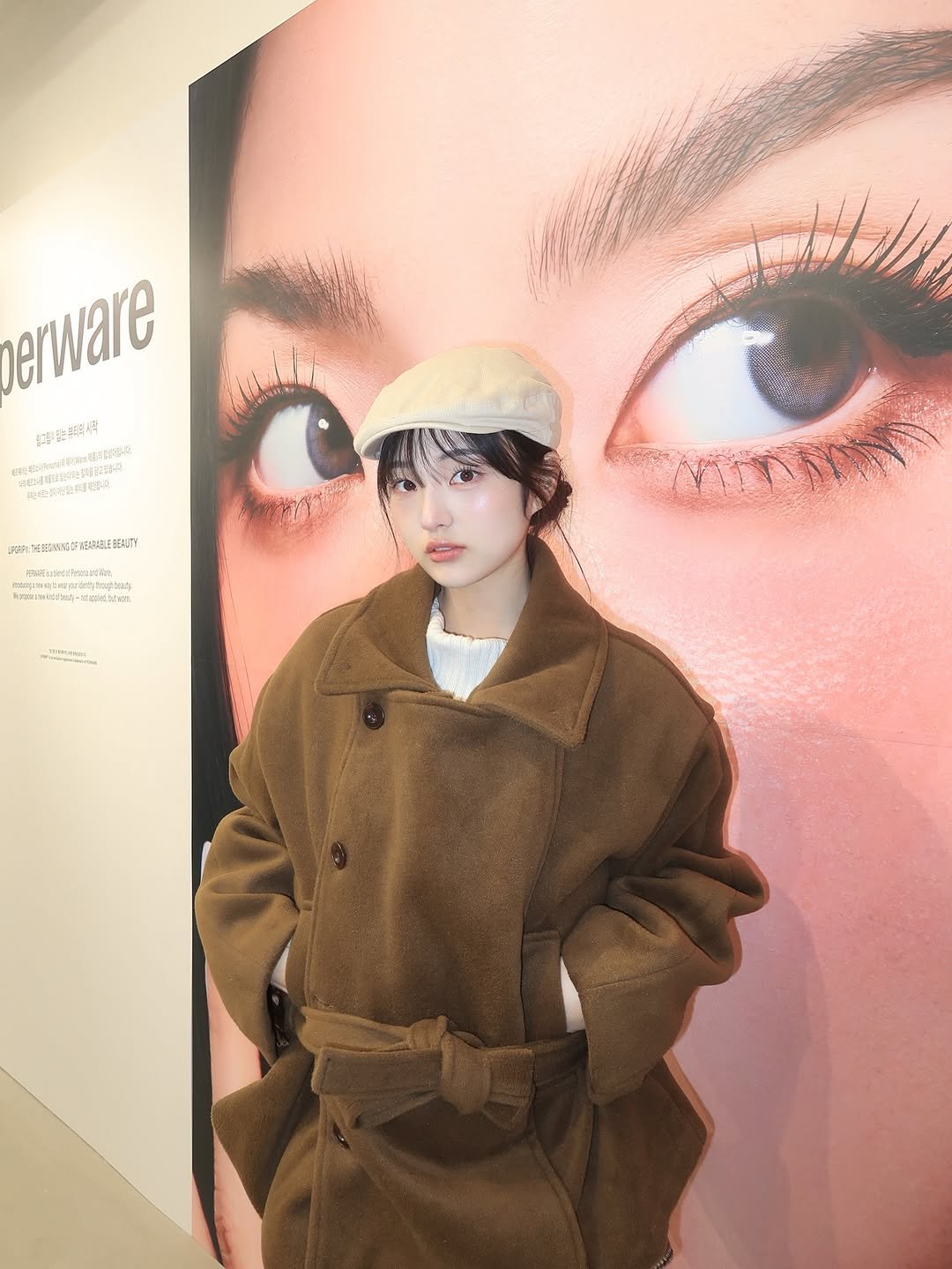 Photo shared by 소이 on October 29, 2025 tagging @perware.official. May be an image of duffle coat, overcoat, parka, beret and text.