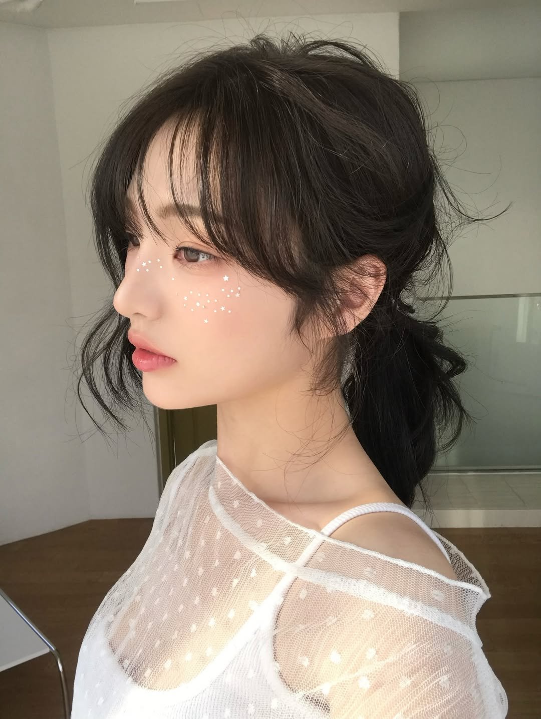 Photo by 소이 on December 06, 2025. May be an image of one or more people, braids, bangs, makeup, top and text.