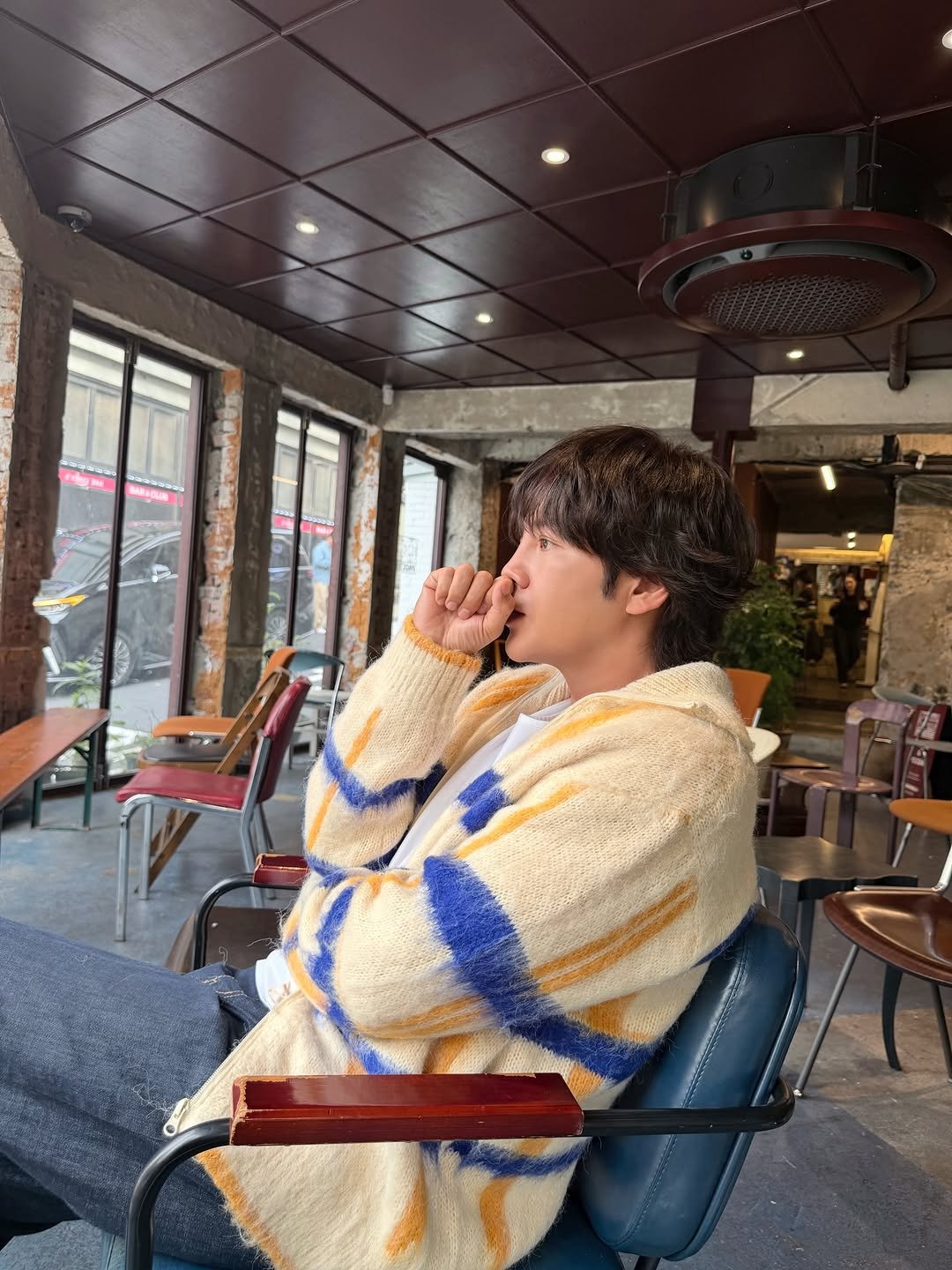 Photo by 장근석 Jang Keun-suk on February 02, 2026. May be an image of one or more people, hair, duffle coat, sweater, knit and text.