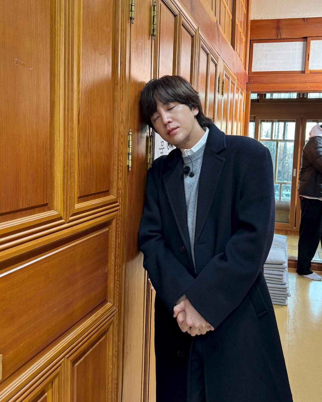 Photo by 장근석 Jang Keun-suk on February 17, 2026. May be an image of duffle coat, overcoat, bolo tie and text.