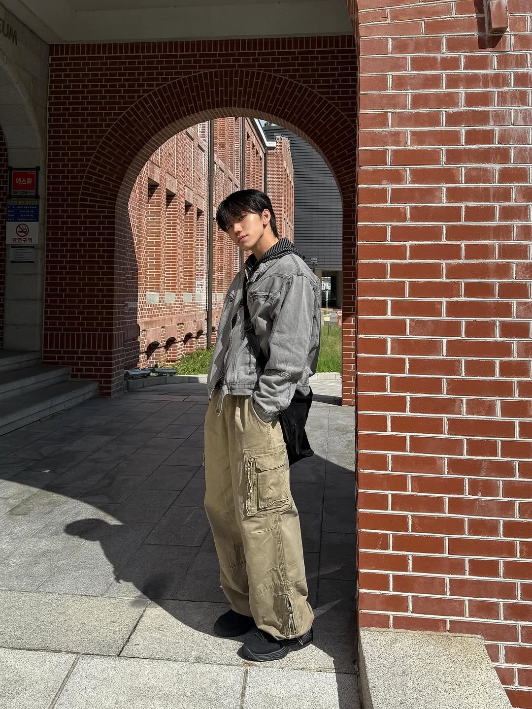 Photo by 김용빈 / 유포어 on September 25, 2025. May be an image of 1 person, military uniform, brick wall and text.