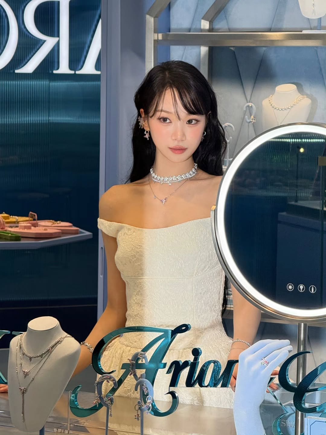 Photo shared by 김채원 (CHAEWON) on April 11, 2026 tagging @swarovski. May be an image of dress and text that says 'д Аок rian'.