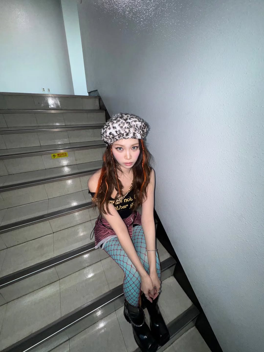 Photo by 김채원 (CHAEWON) on November 10, 2025. May be an image of one or more people, hair, headscarf, bandanna, beret, bowler hat and text.