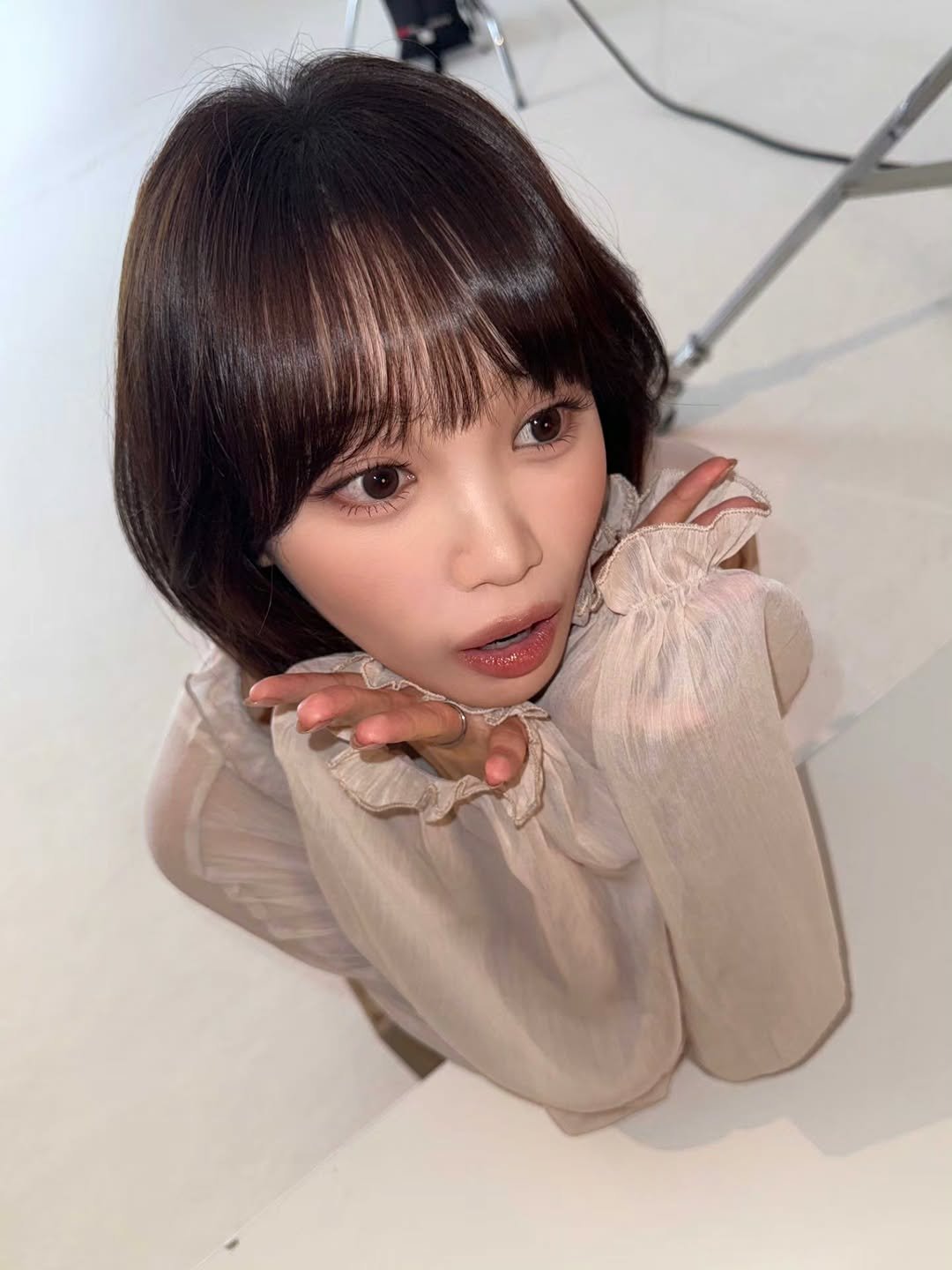 Photo by 김채원 (CHAEWON) on April 07, 2026. May be an image of one or more people, bangs, top and text.