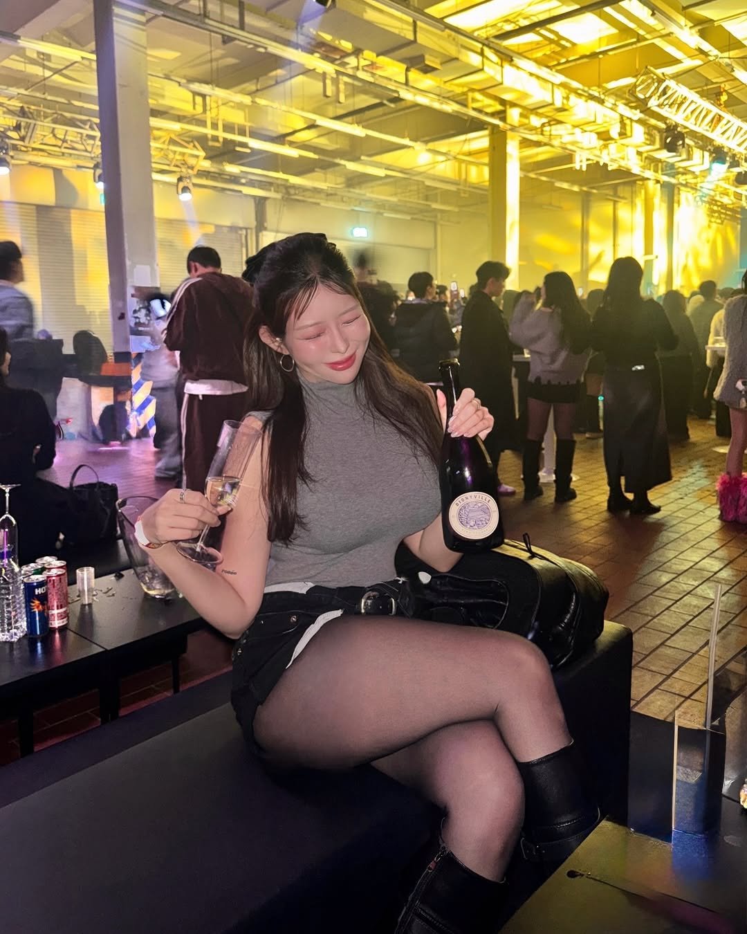 Photo shared by 차밍슬 | 공간대여 * 자기계발 on December 26, 2025 tagging @cmf.seongsu. May be an image of drink, miniskirt, fishnet stockings, night and text.