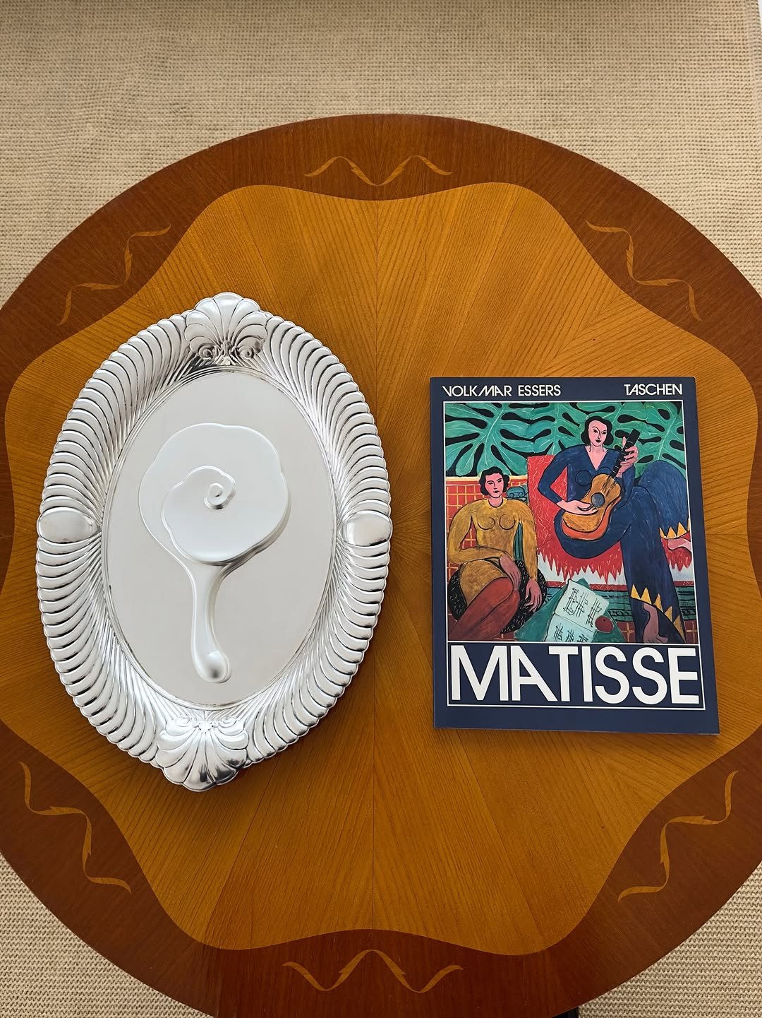 Photo by COLLECTION OF on September 06, 2025. May be an image of book, placemat, napkin and text that says 'VOLKMAR VOLK/MARESSERS VOL ESSERS TASCHEN MATISSE ن'.