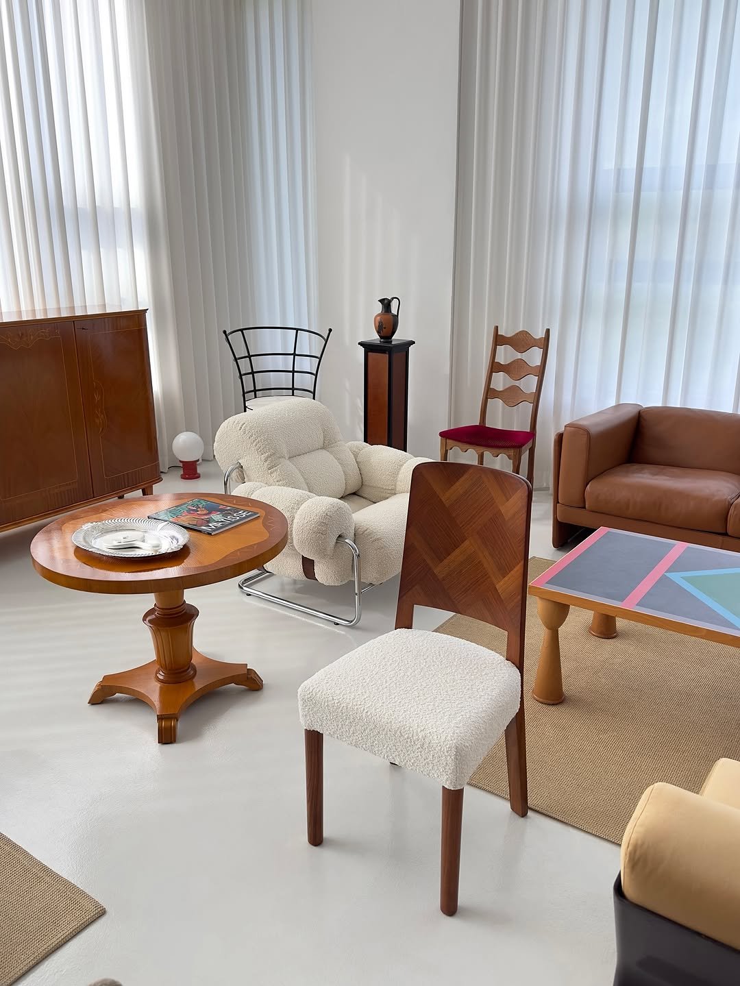 Photo by COLLECTION OF in Collection Of. May be an image of table, sofa, armchair, living room, indoors and text.