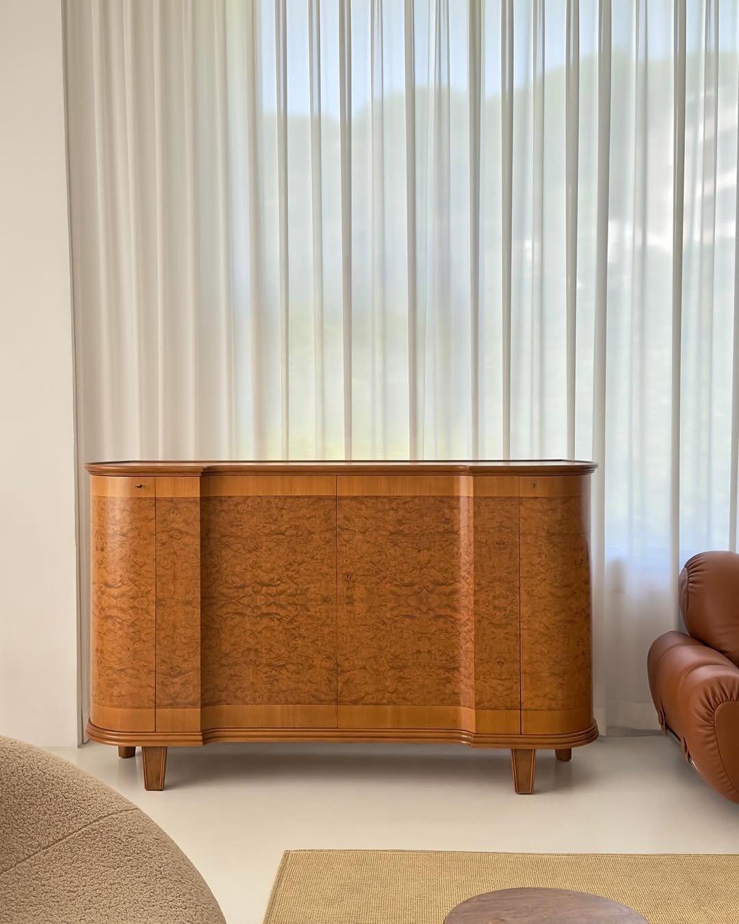 Photo by COLLECTION OF on March 11, 2026. May be an image of credenza, curtains, armoire, indoors and text.
