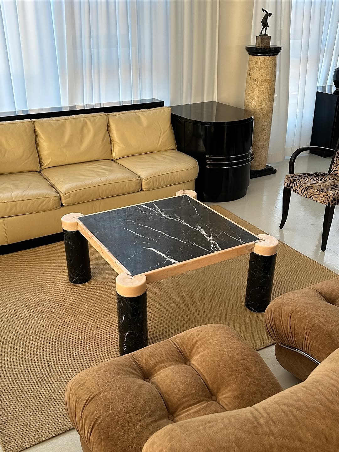 Photo by COLLECTION OF in Collection Of. May be an image of table, sofa, dining table, armchair, indoors, living room and text.