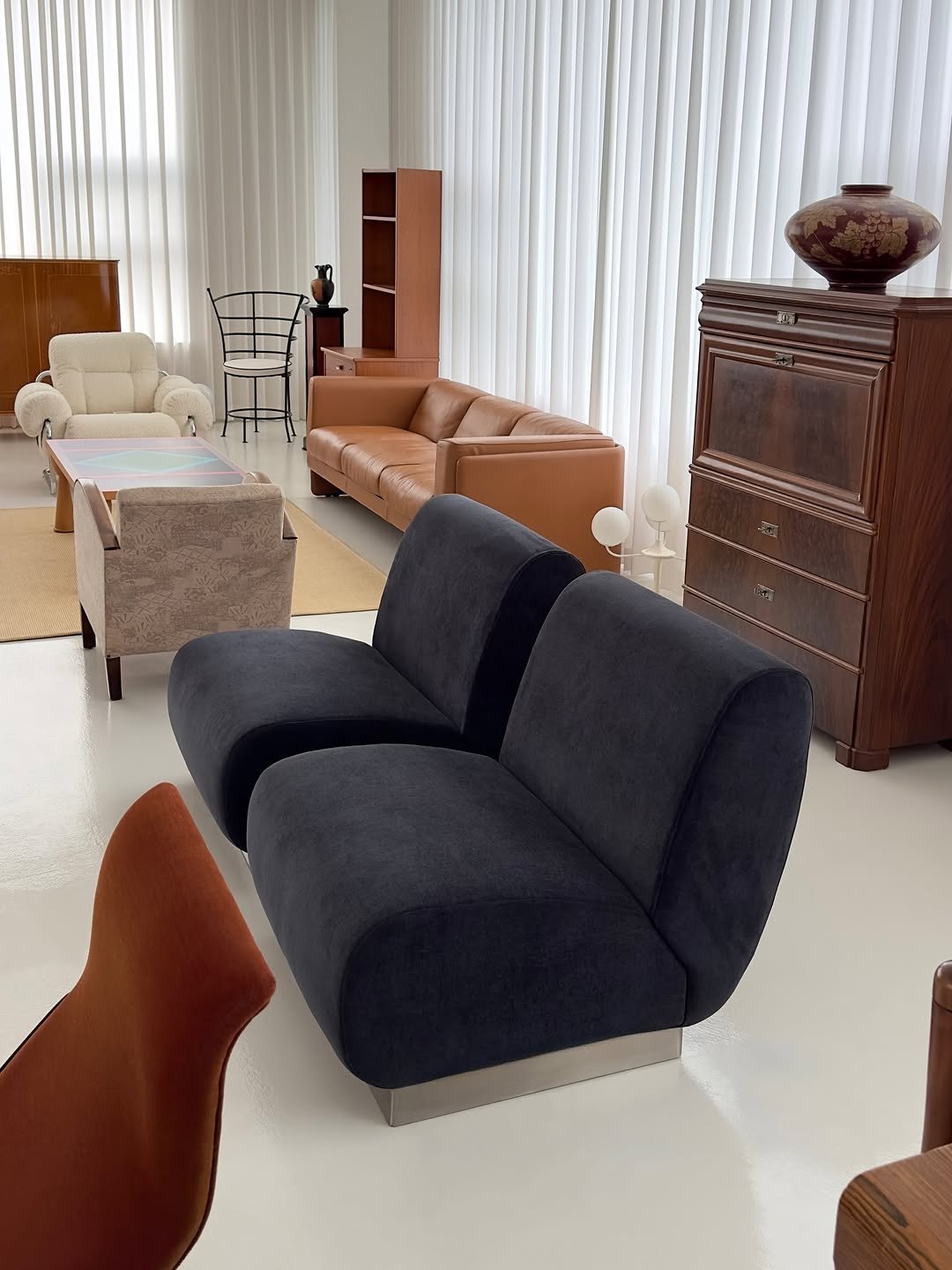 Photo by COLLECTION OF on October 13, 2025. May be an image of armchair, sofa, ottoman, chaise lounge, living room, indoors and text.