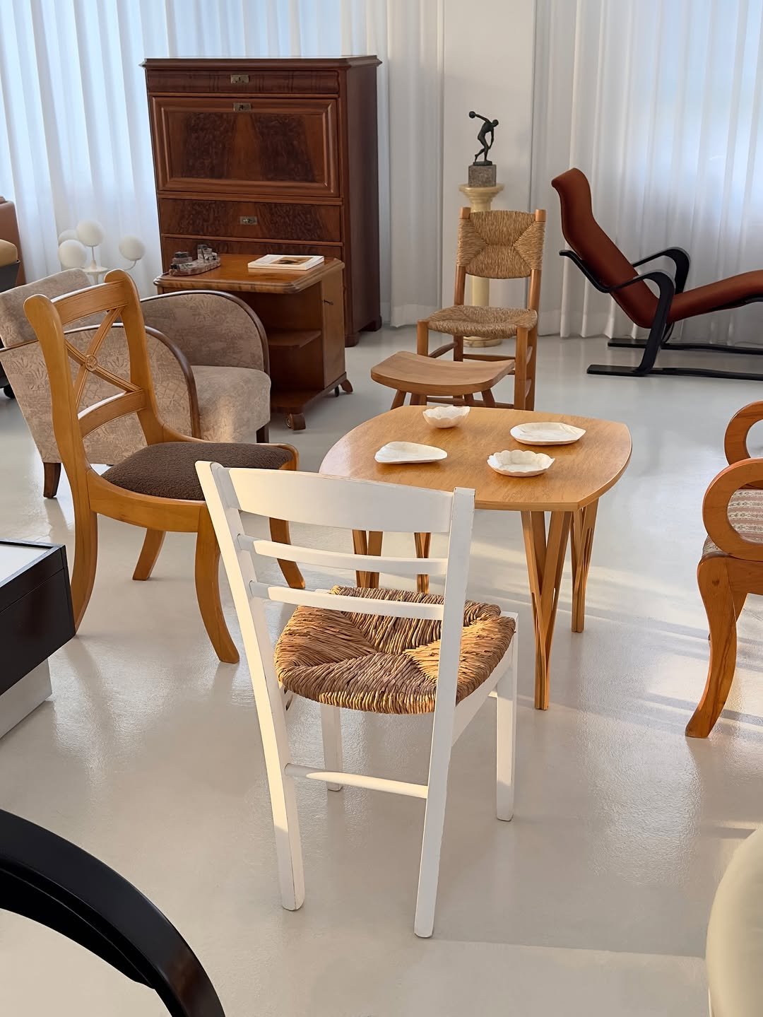 Photo by COLLECTION OF in Collection Of. May be an image of table, armchair, chair, dining table, indoors and text.