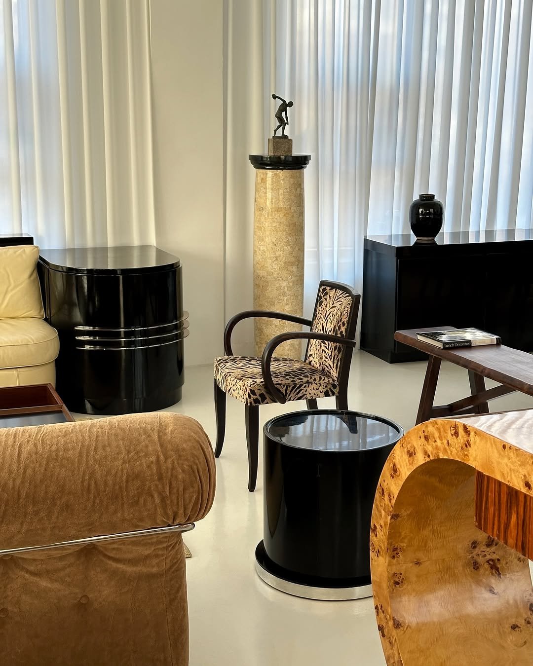 Photo by COLLECTION OF on January 06, 2026. May be an image of curtains, armchair, chaise lounge, indoors, living room and text.