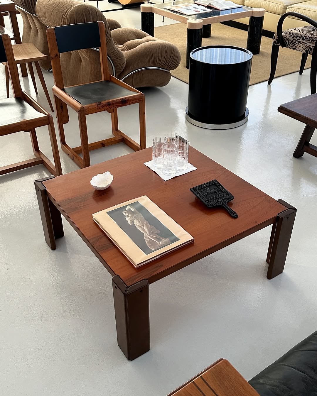 Photo by COLLECTION OF in Collection Of. May be an image of table, dining table, deck chair, armchair, indoors and text.