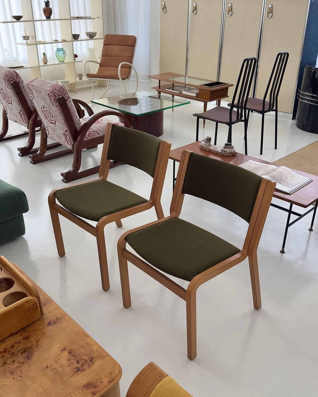 Photo by COLLECTION OF in Collection Of. May be an image of table, armchair, rocking chair, dining table, chair, indoors and text.