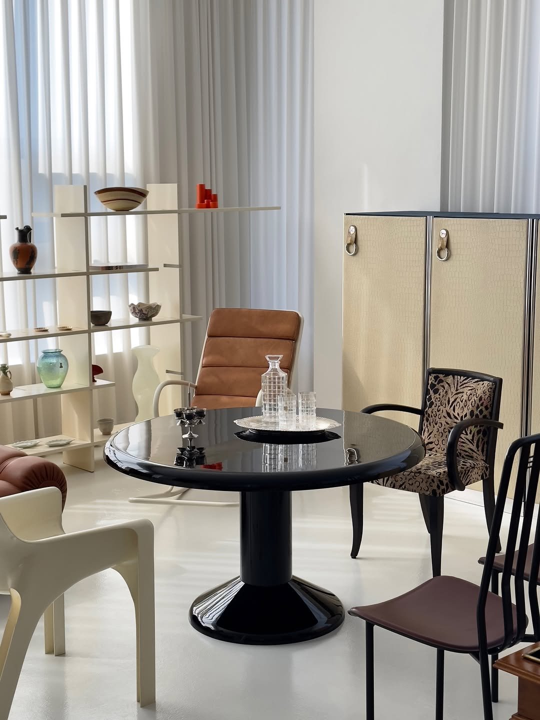 Photo by COLLECTION OF in Collection Of. May be an image of sink, table, armchair, dining table, indoors and text.