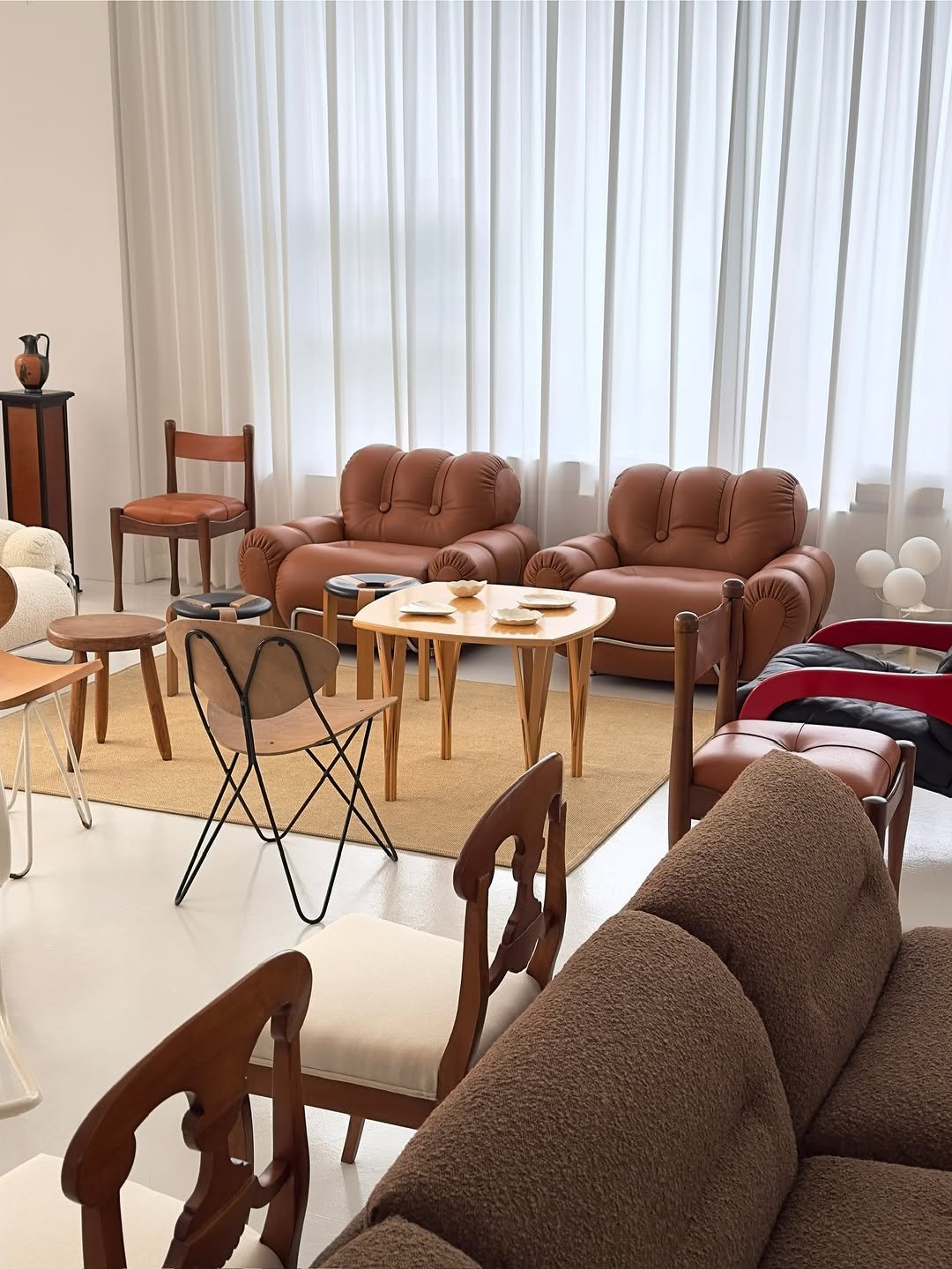 Photo by COLLECTION OF in Collection Of. May be an image of futon, armchair, sofa, chaise lounge, living room, indoors and text.