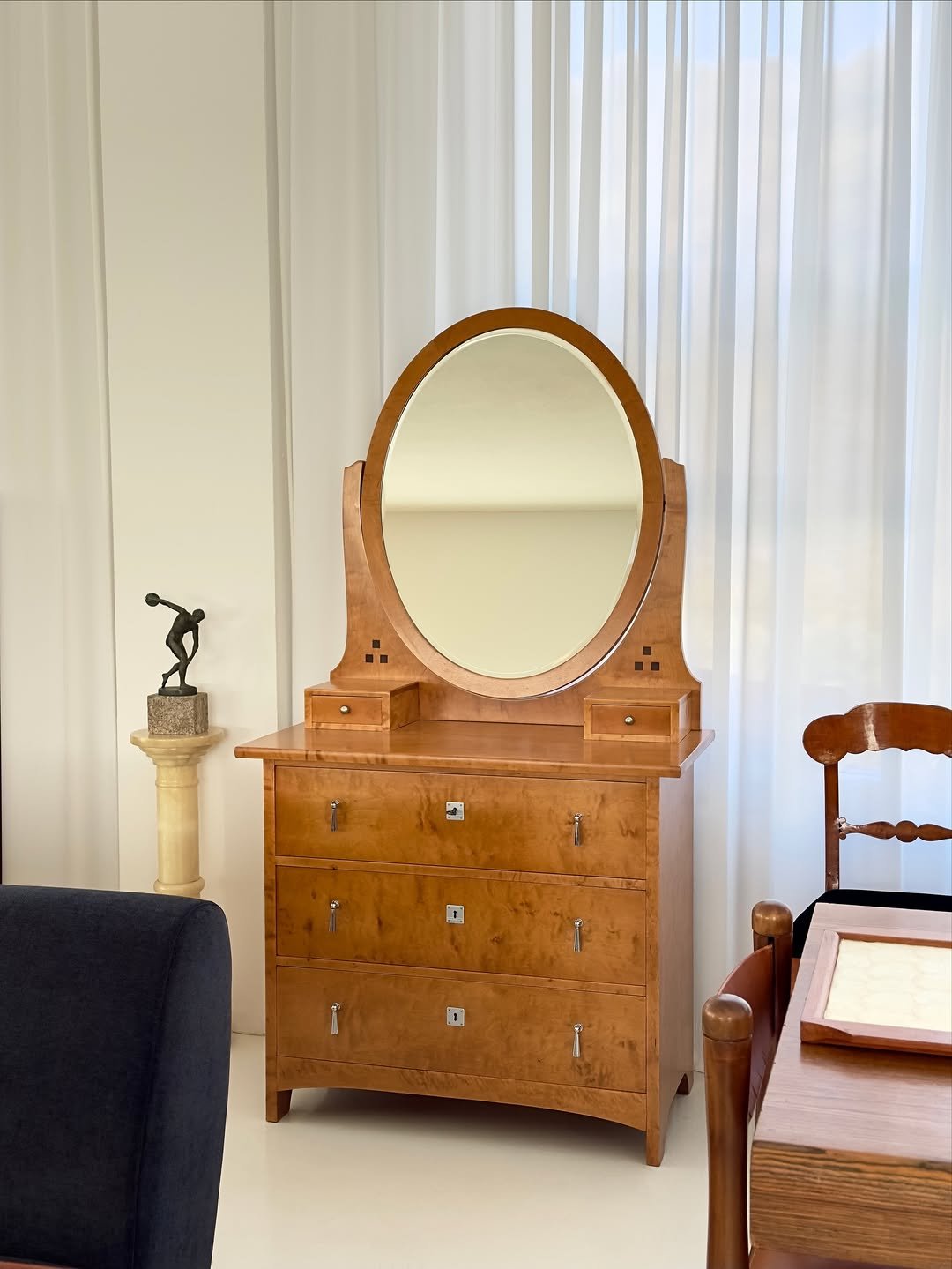 Photo by COLLECTION OF on November 20, 2025. May be an image of bed, credenza, mirror, bureau, armoire and text.