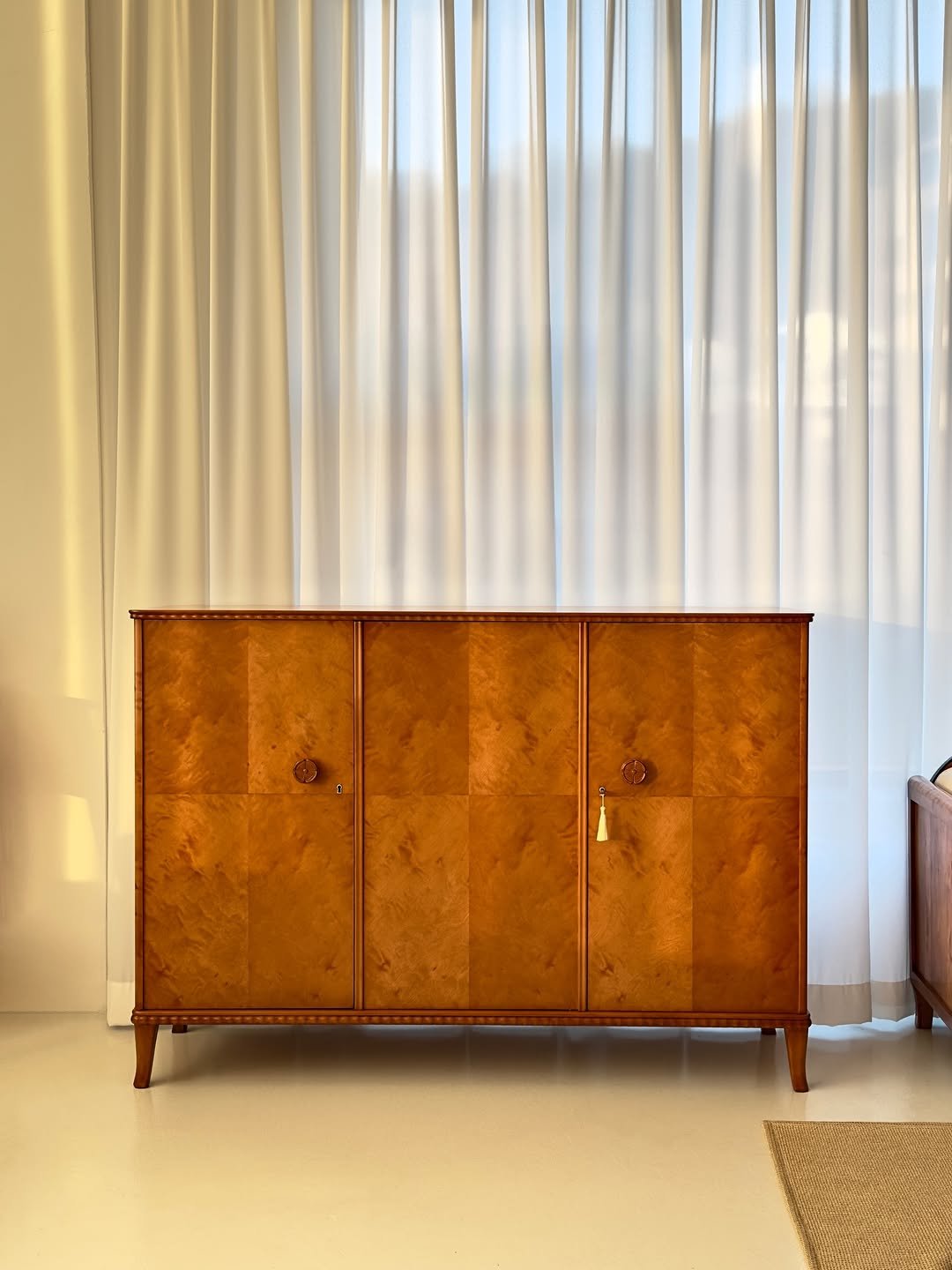 Photo by COLLECTION OF on December 11, 2025. May be an image of credenza, curtains, armoire, bureau, indoors and text.