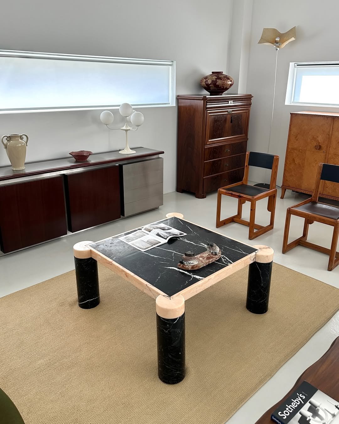 Photo by COLLECTION OF in Collection Of. May be an image of table, credenza, dining table, indoors and text.