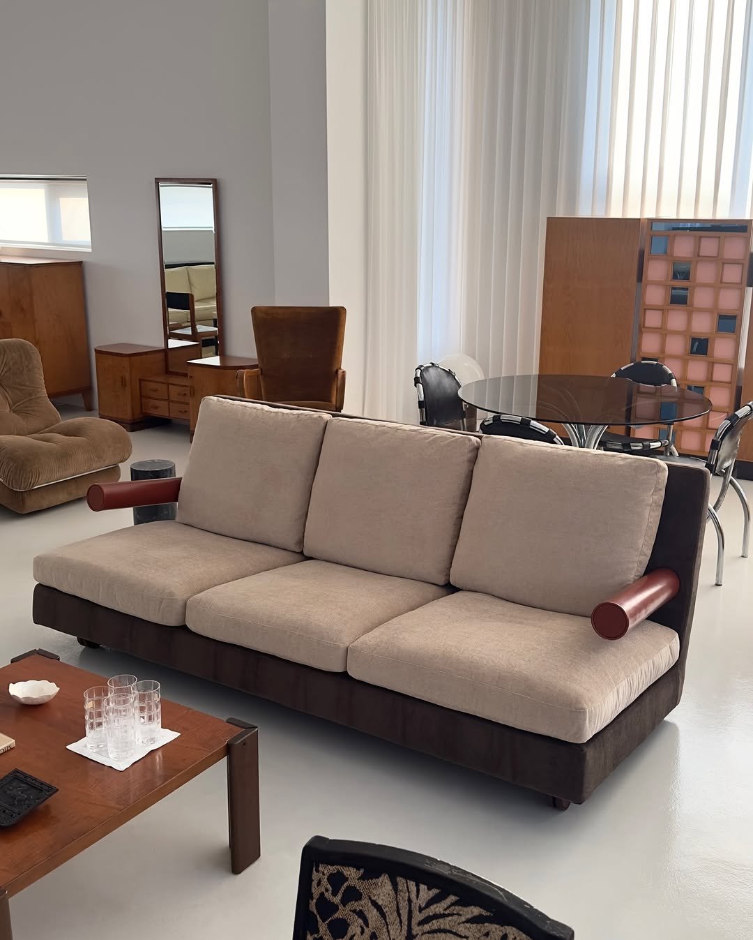 Photo by COLLECTION OF on March 26, 2026. May be an image of futon, armchair, sofa, chaise lounge, living room, indoors and text.