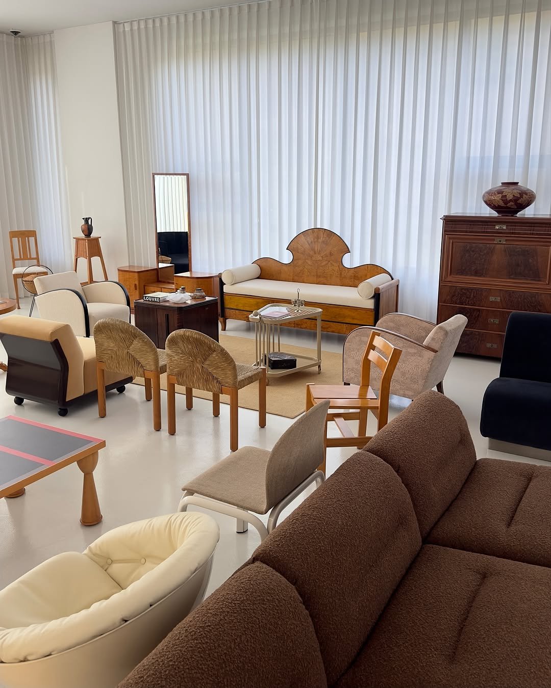 Photo by COLLECTION OF on November 10, 2025. May be an image of sink, sofa, armchair, chaise lounge, living room, indoors and text.