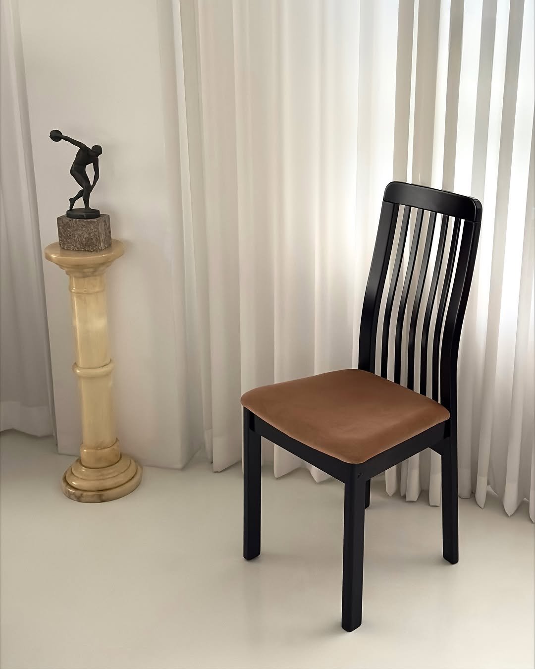 Photo by COLLECTION OF on October 22, 2025. May be an image of rocking chair, armchair, footstool, chair, indoors and text.