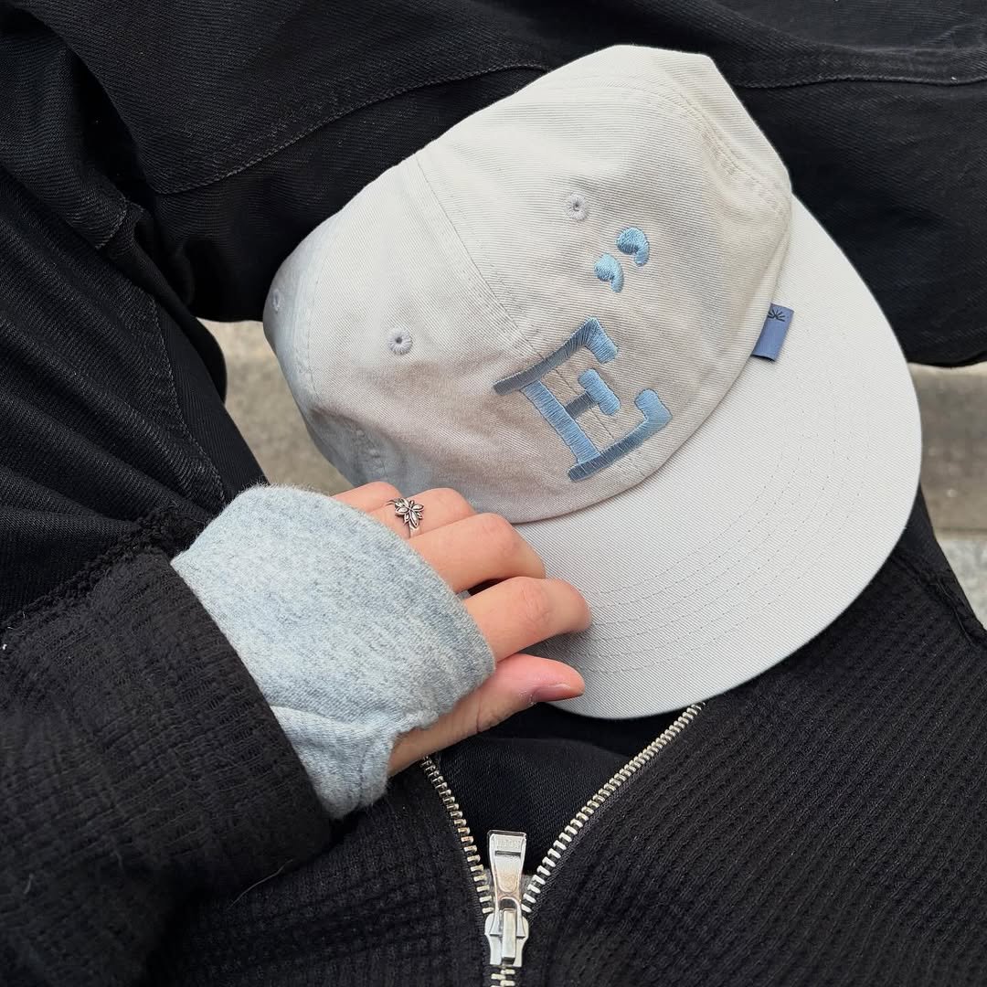 Photo shared by 동규 | 패션 크리에이터 on November 19, 2025 tagging @egu_shop. May be an image of hat, parka, sweatshirt, sweatpants, fleece and text.