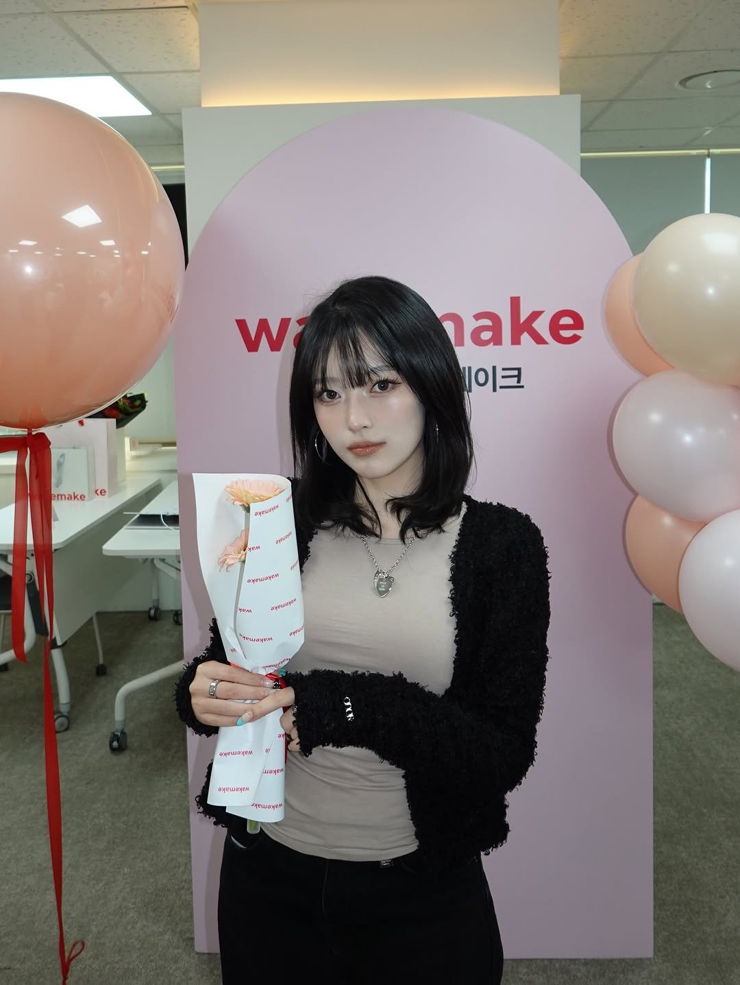 Photo shared by 김은솔 on December 13, 2025 tagging @wakemake_official. May be an image of one or more people, makeup, lollipop, hand cream and text.