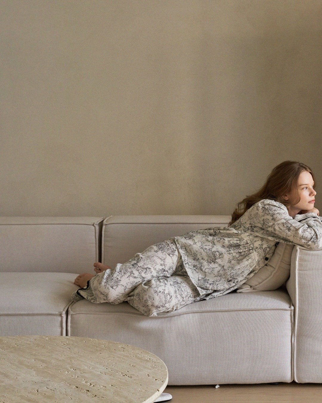 Photo by DUBLEVE 드브르베 on December 16, 2025. May be an image of sleepwear, sofa, chaise lounge and text.