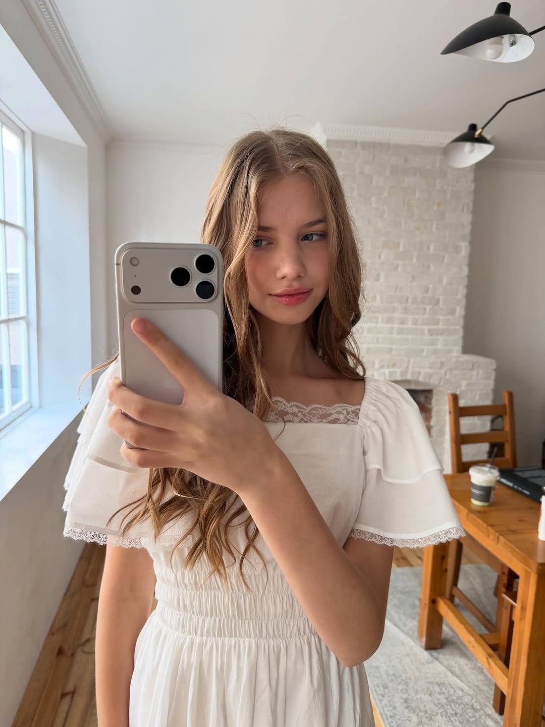 Photo by DUBLEVE 드브르베 on December 26, 2025. May be a selfie of one or more people, hair, phone, mirror, dress, sundress and text.