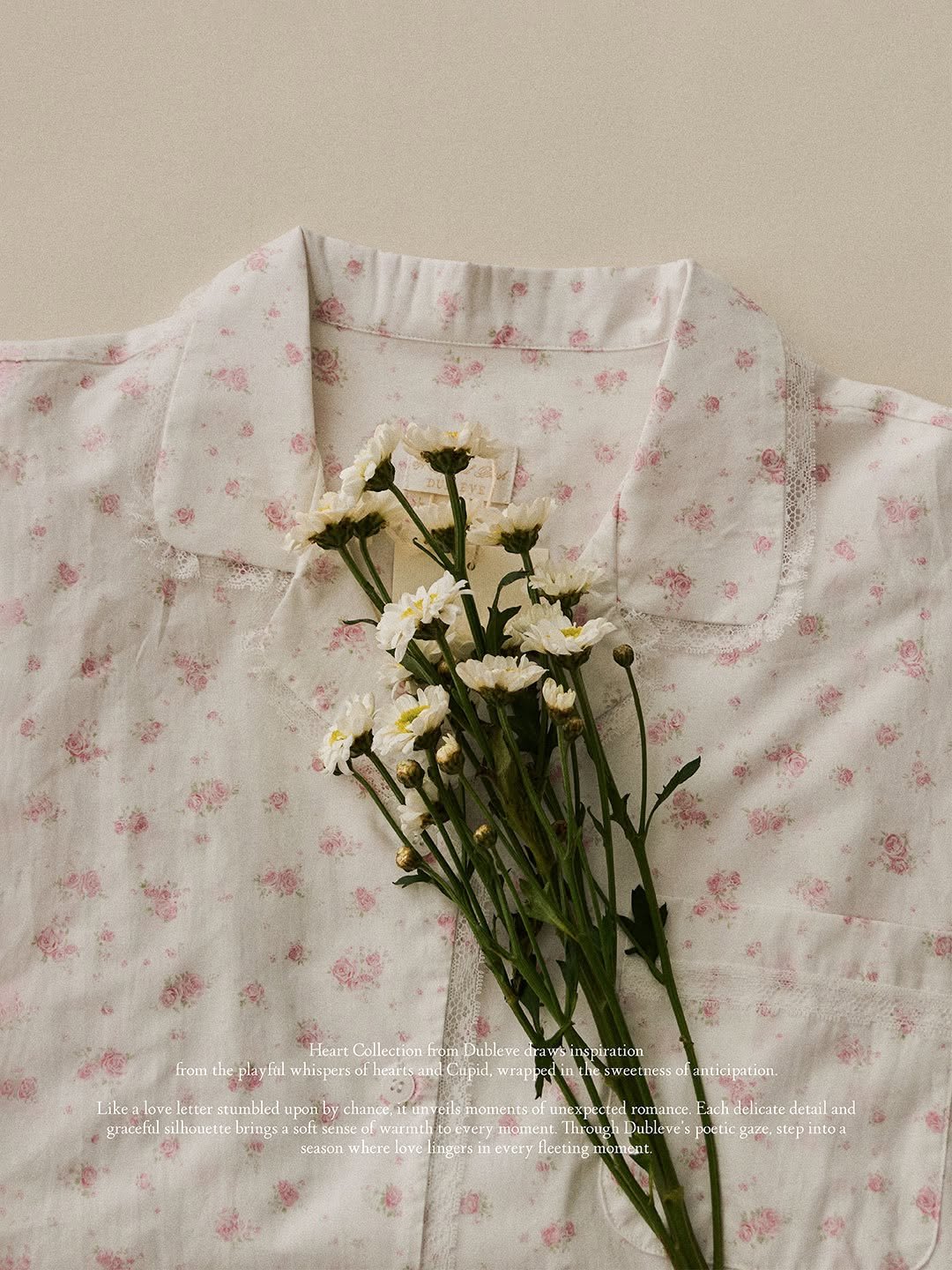 Photo by DUBLEVE 드브르베 on April 12, 2026. May be an image of sleepwear, baby's-breath and text that says 'from Heart Collection rom Dublevedr dra wsinspiration playfi fal whisperso Gupid. wrappe messo anticipation, Like love letter stumbled uponby chance, itunycils moments unexpected cted romance. delicate detail and gracefal ilhovert gecflilileuss.a.eaeac brings: armti moment. woughDubleve's etic ThvougkDubieve'spoeticgaze.st gaze, step season where love ingersi every fleetingmorment. fleeting'.