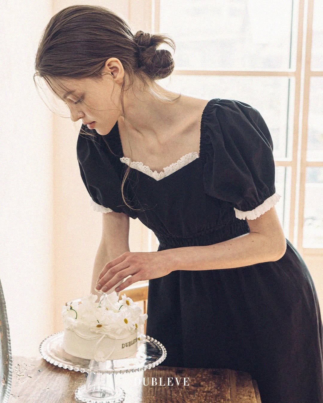 Photo by DUBLEVE 드브르베 on January 02, 2026. May be an image of cake, dress and text.