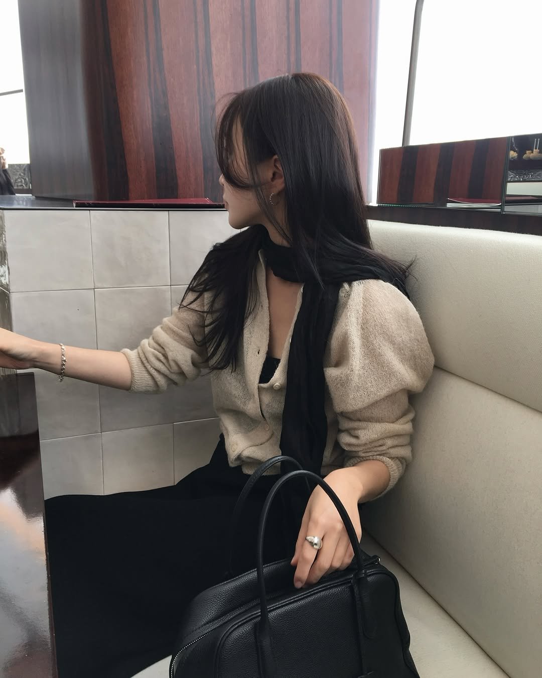 Photo shared by 혜정 on March 10, 2026 tagging @howtoloveme_official. May be an image of blazer, purse, clutch and text.