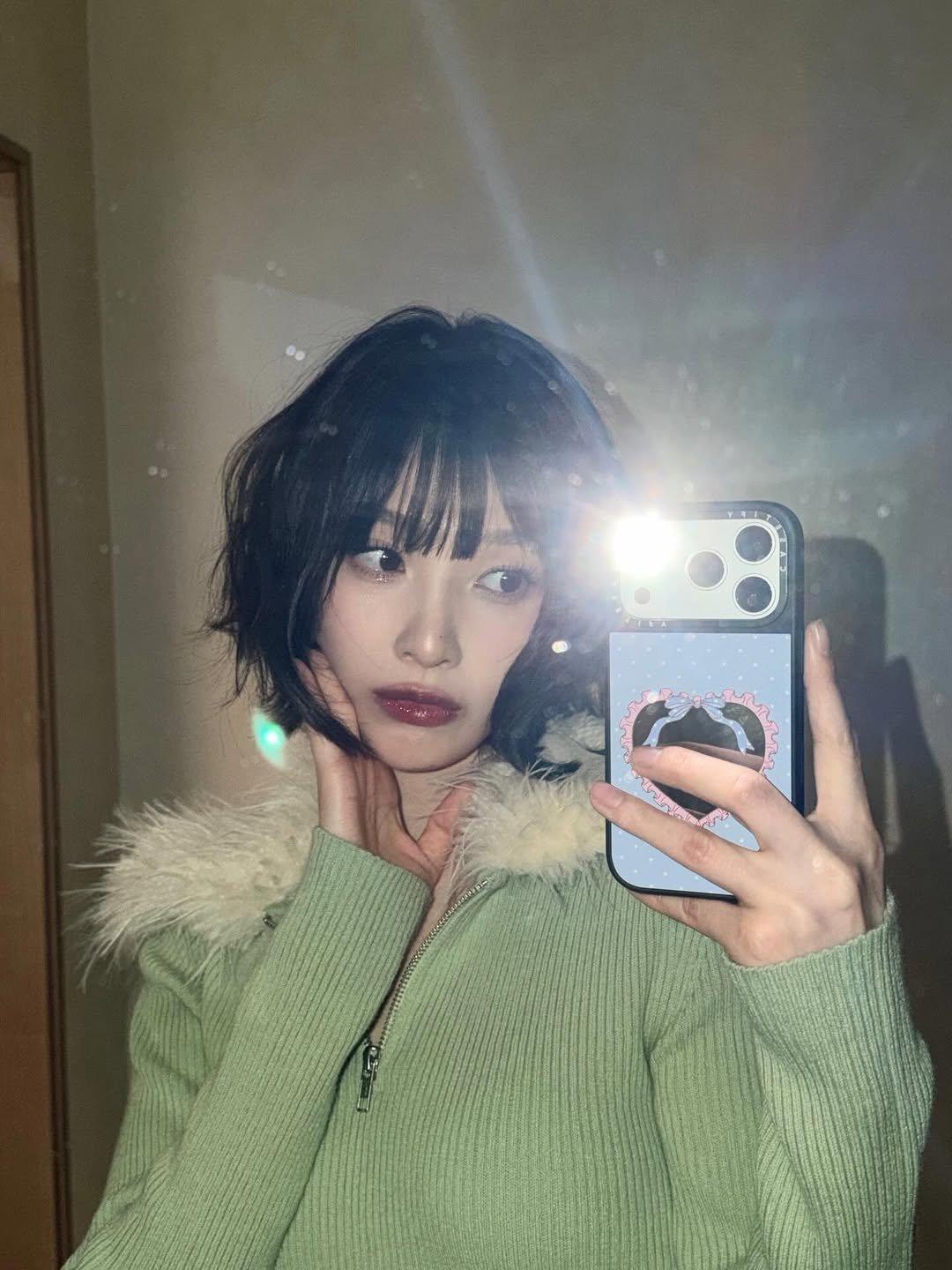 Photo by Joy on December 27, 2025. May be a selfie of one or more people, bangs, makeup, turtleneck, mirror, parka and text.