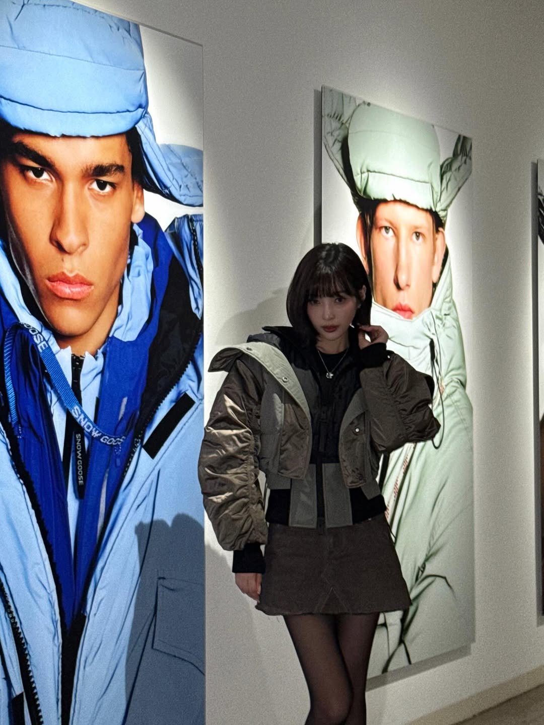 Photo shared by Joy on December 04, 2025 tagging @canadagoose. May be an image of standing, overcoat, duffle coat, turtleneck, sportswear, parka, beret and text.