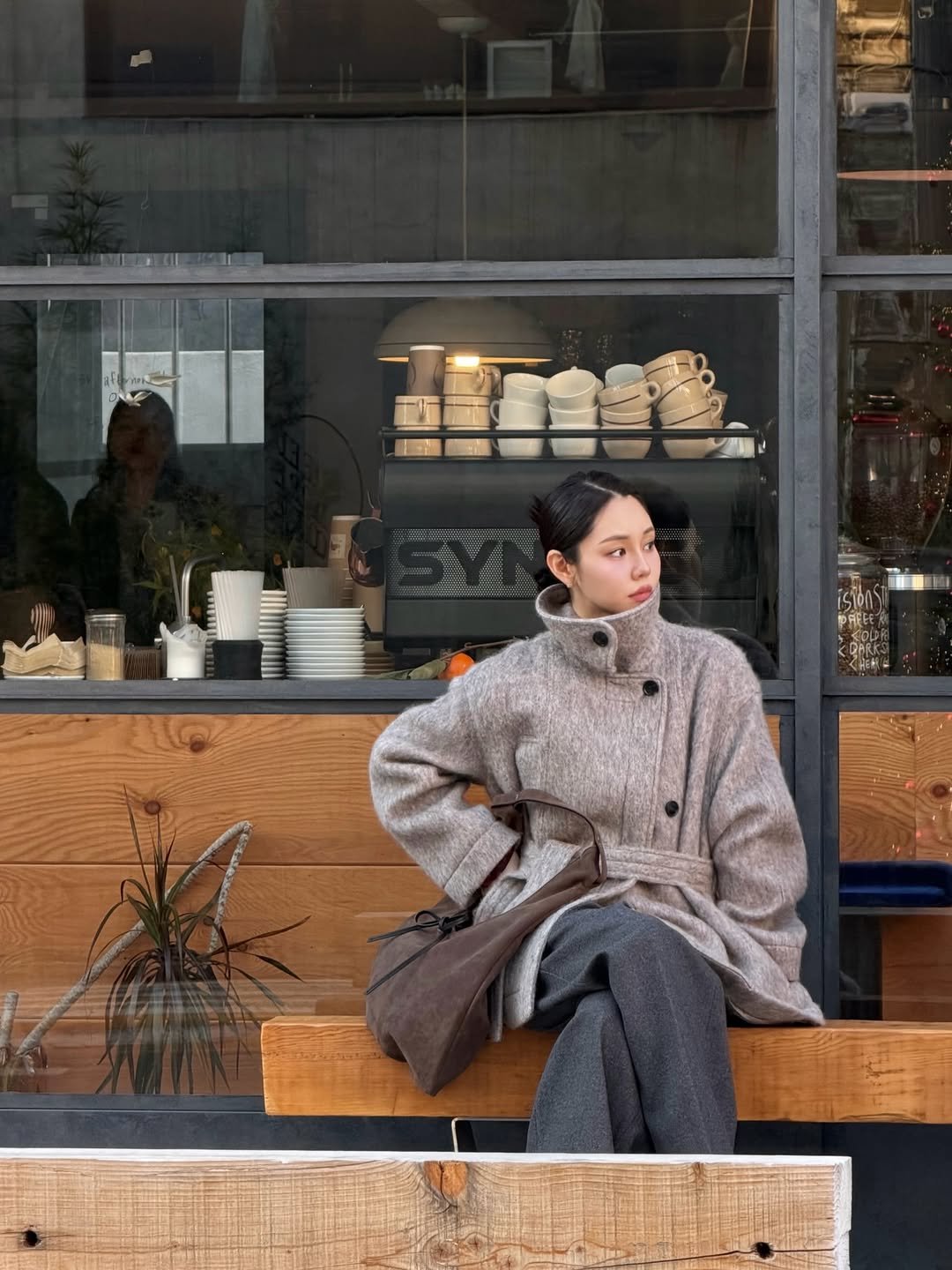 Photo shared by 혜인 on November 20, 2025 tagging @artid_official. May be an image of duffle coat, overcoat, turtleneck, parka, cornflower and text.