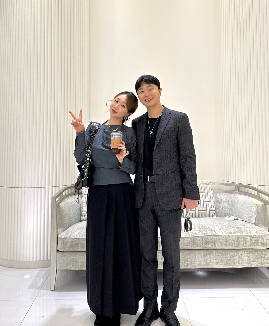 Photo shared by 지냐 Jɪɴʏᴀᴀ on October 17, 2025 tagging @junsu_zzang. May be an image of one or more people, overcoat, suit, dinner jacket, blazer and text.