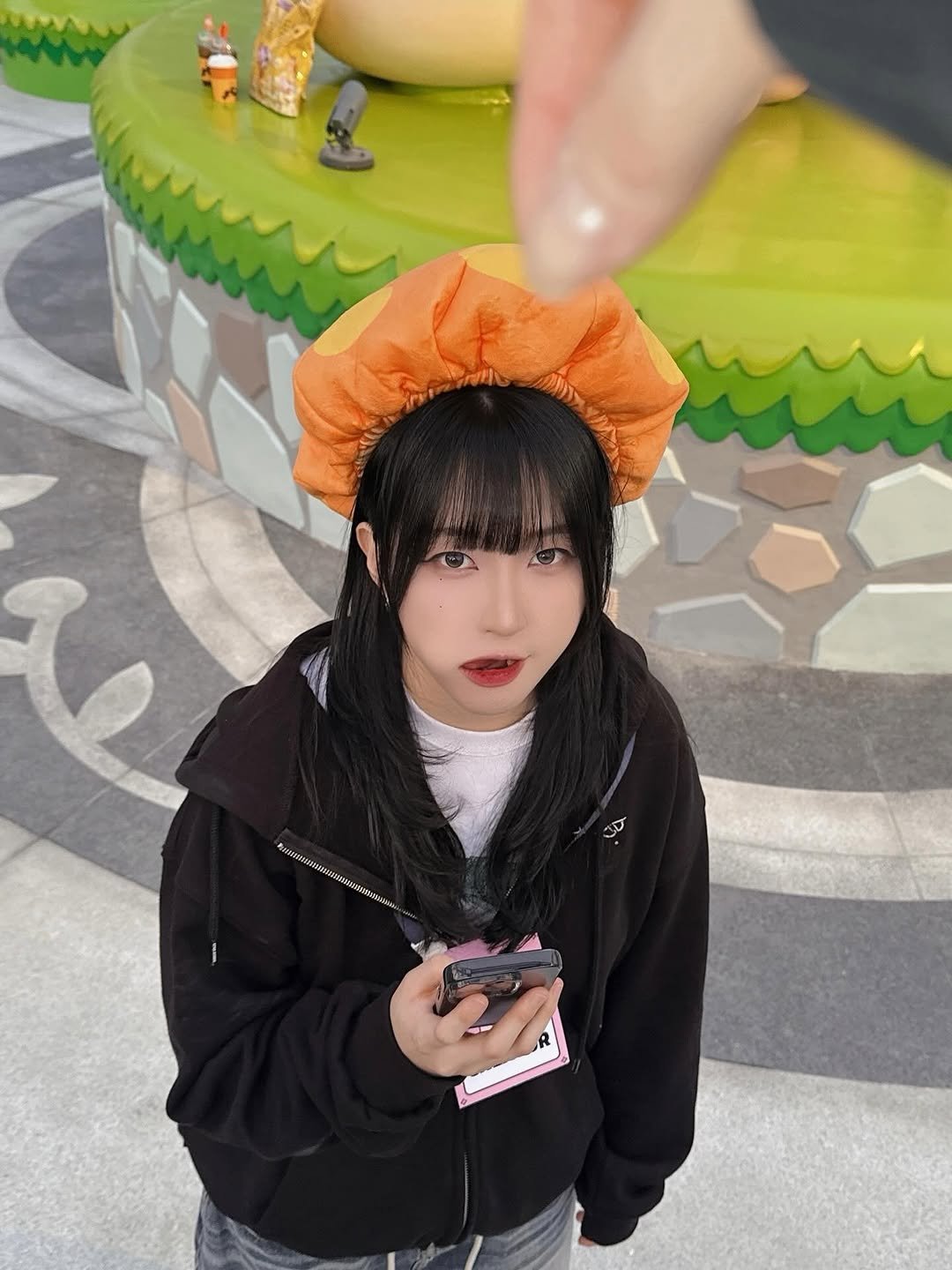 Photo by 쿠빈 KUBIN on April 01, 2026. May be an image of hat, cloak, beret, costume and text.