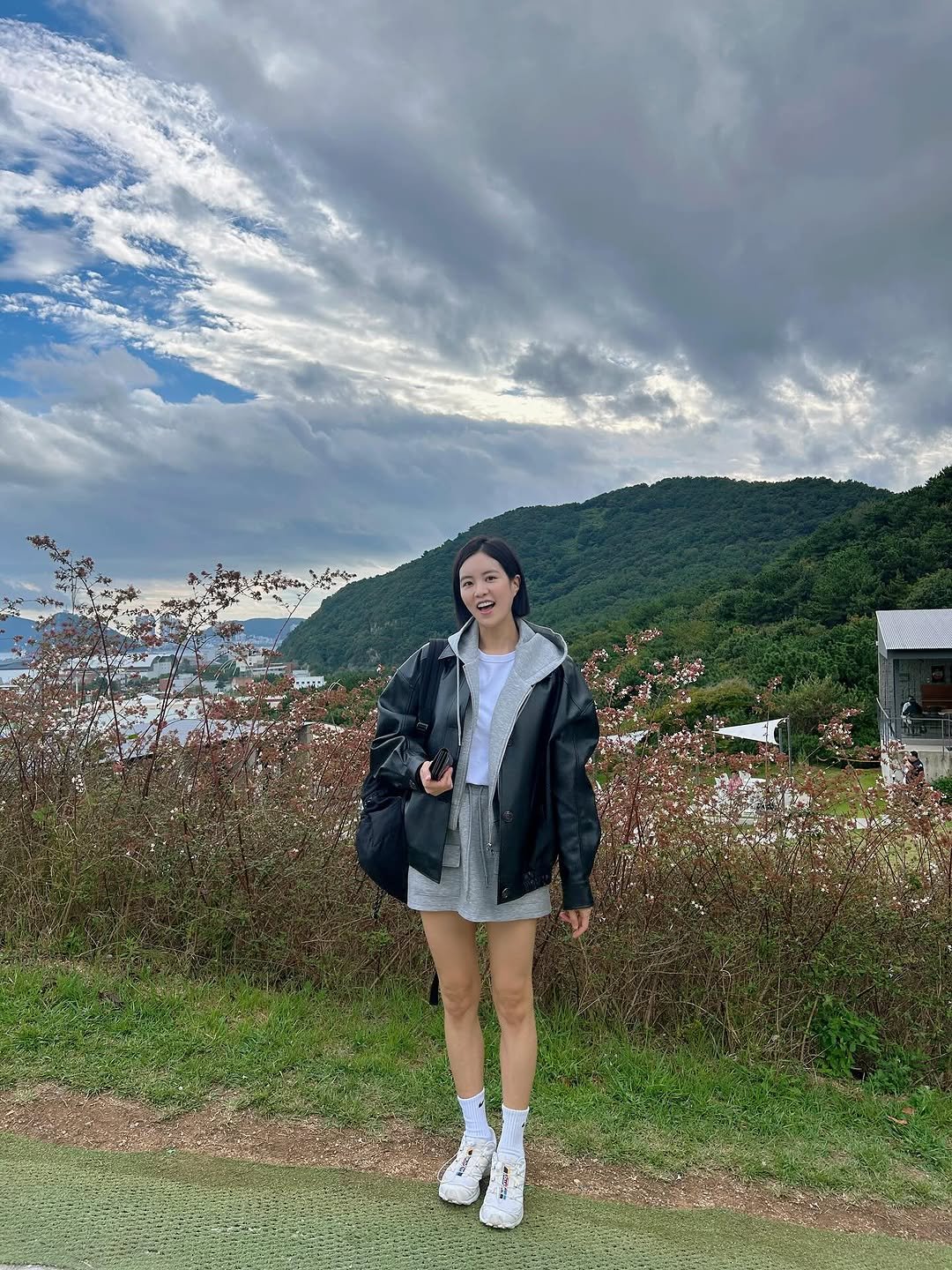 Photo shared by CHOI YEOKYUNG on September 28, 2025 tagging @thetav_official, and @so_ir_official. May be an image of 1 person, parka, jacket, cloud, Victoria Peak and text.