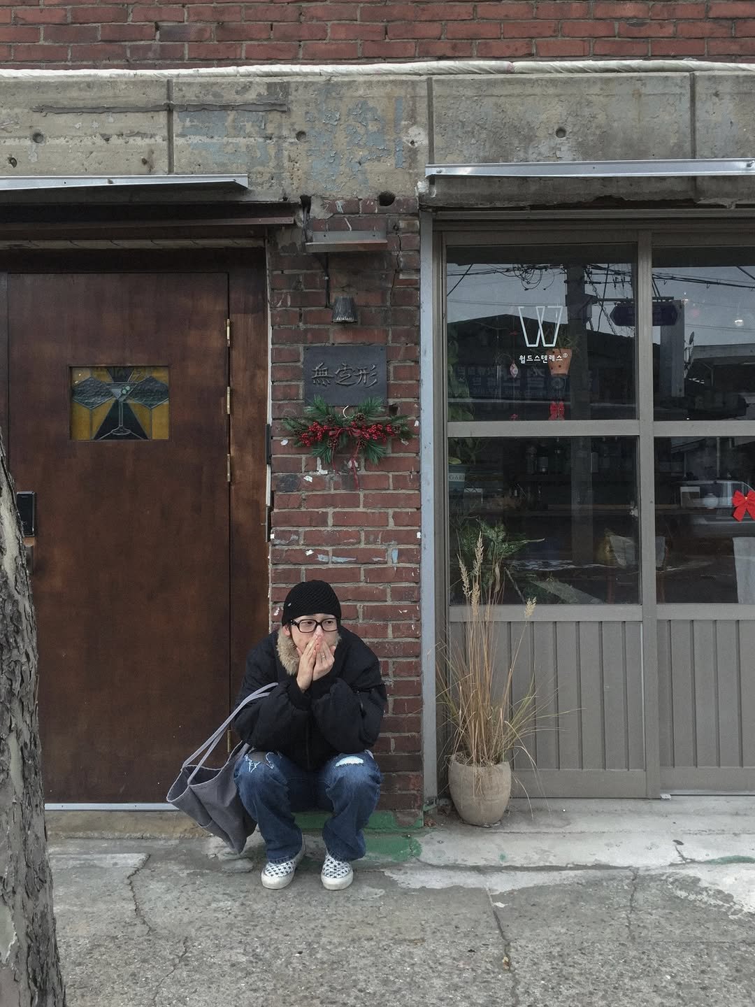 Photo shared by 이준혁 on December 09, 2025 tagging @lofi_official_. May be an image of standing, brick wall and text.