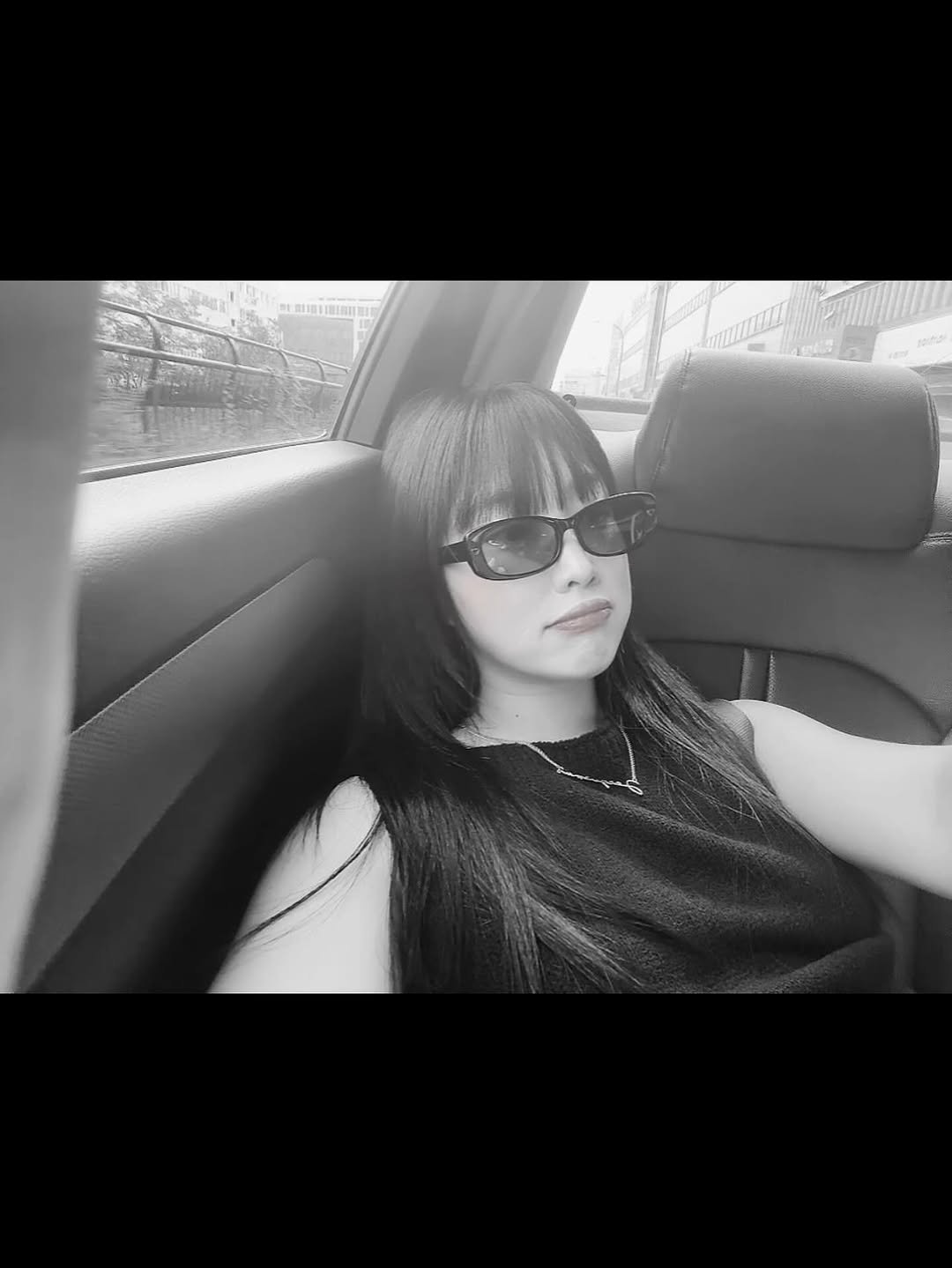 Photo by 이주은 on August 05, 2025. May be a black-and-white image of 1 person, makeup, seatbelt, sunglasses and text.