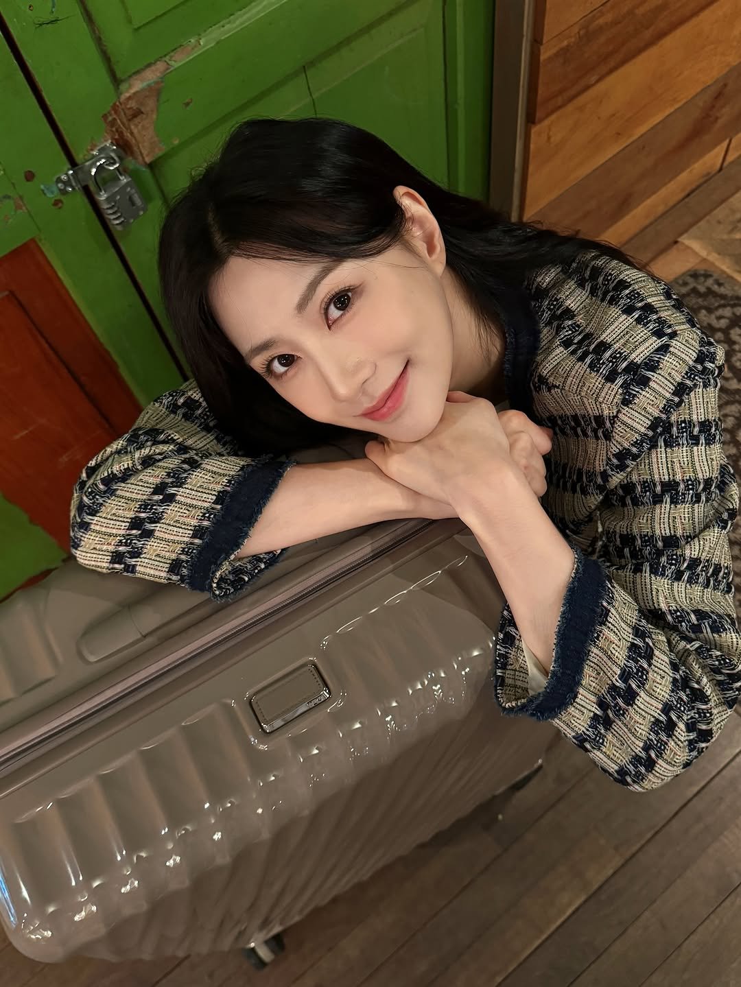 Photo shared by 오하영 Oh Hayoung on October 12, 2025 tagging @tumitravel. May be an image of one or more people, hair, suitcase and text.