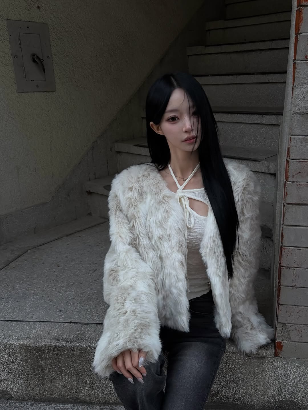 Photo shared by 주연 on January 17, 2026 tagging @painorpleasure_official, and @as_on_official. May be an image of one or more people, hair, sable coat, goosedown coat, fishnet stockings, parka and text.