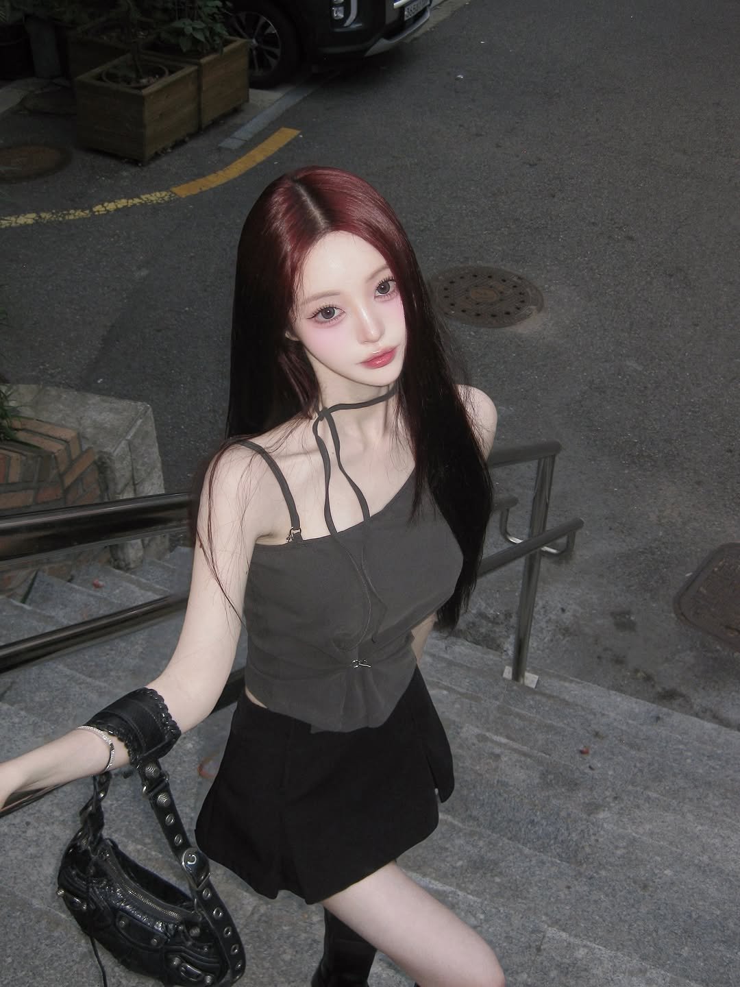 Photo shared by 주연 on August 14, 2025 tagging @painorpleasure_official. May be an image of 1 person, hair, miniskirt and text.