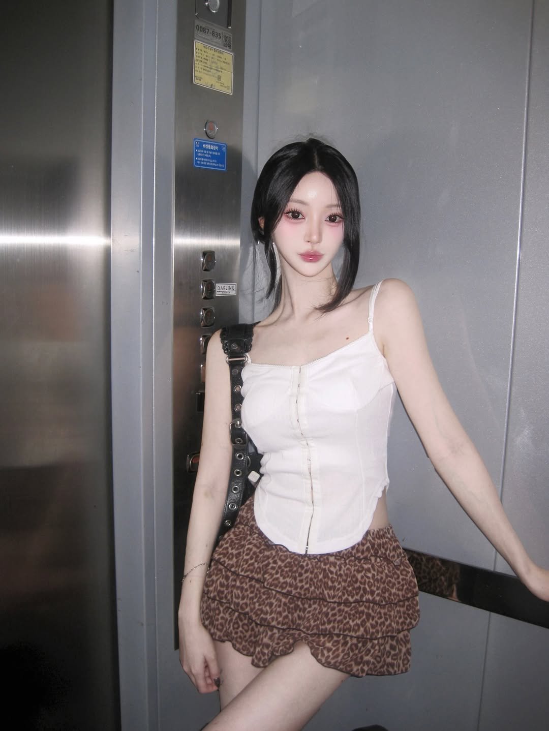 Photo shared by 주연 on August 25, 2025 tagging @pleasenofollow_official. May be an image of one or more people, hair, miniskirt, shorts, top and text.
